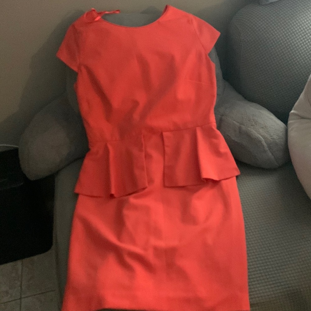 This dress is color orange size 8